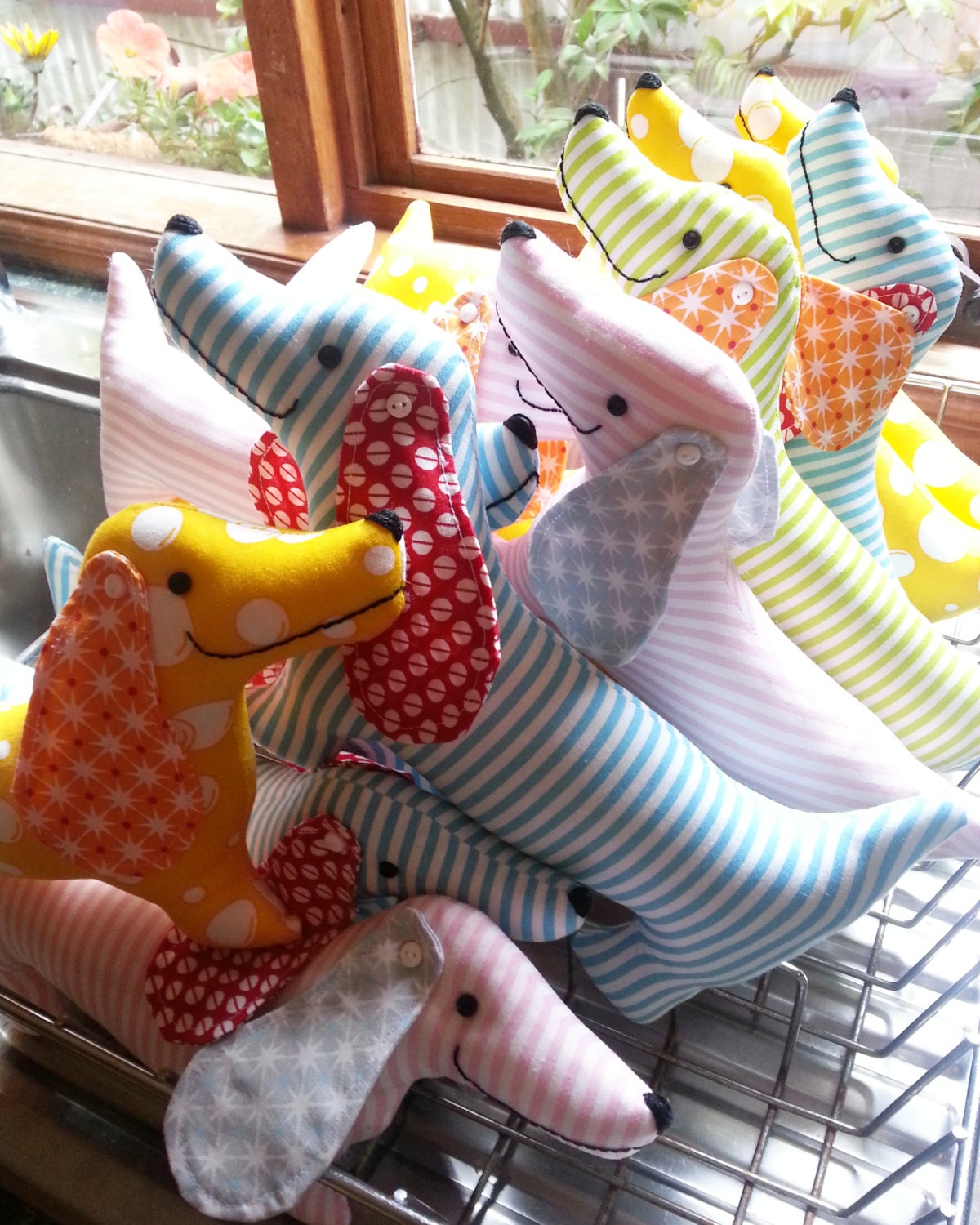 a group of simple sausage dog fabric toys