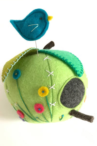 green felt apple pincushion with bluebird pin and embroidered flowers