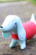 Load image into Gallery viewer, blue felt sausage dog toy in pink coat
