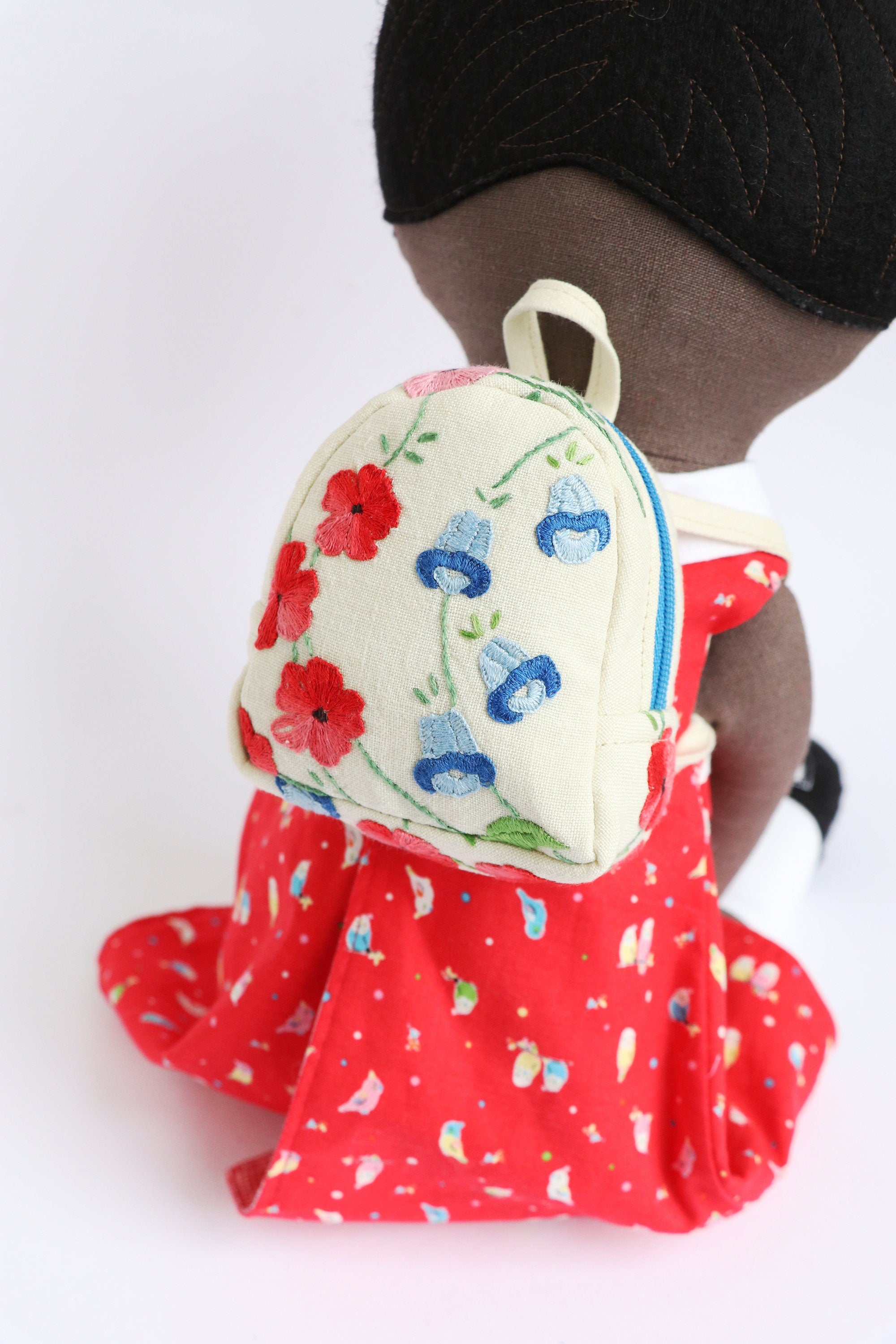 embroidered miniature backpack