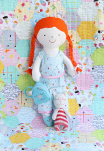 rag doll sewing pattern. Doll with kitty toy and cat backpack wearing blue pyjamas
