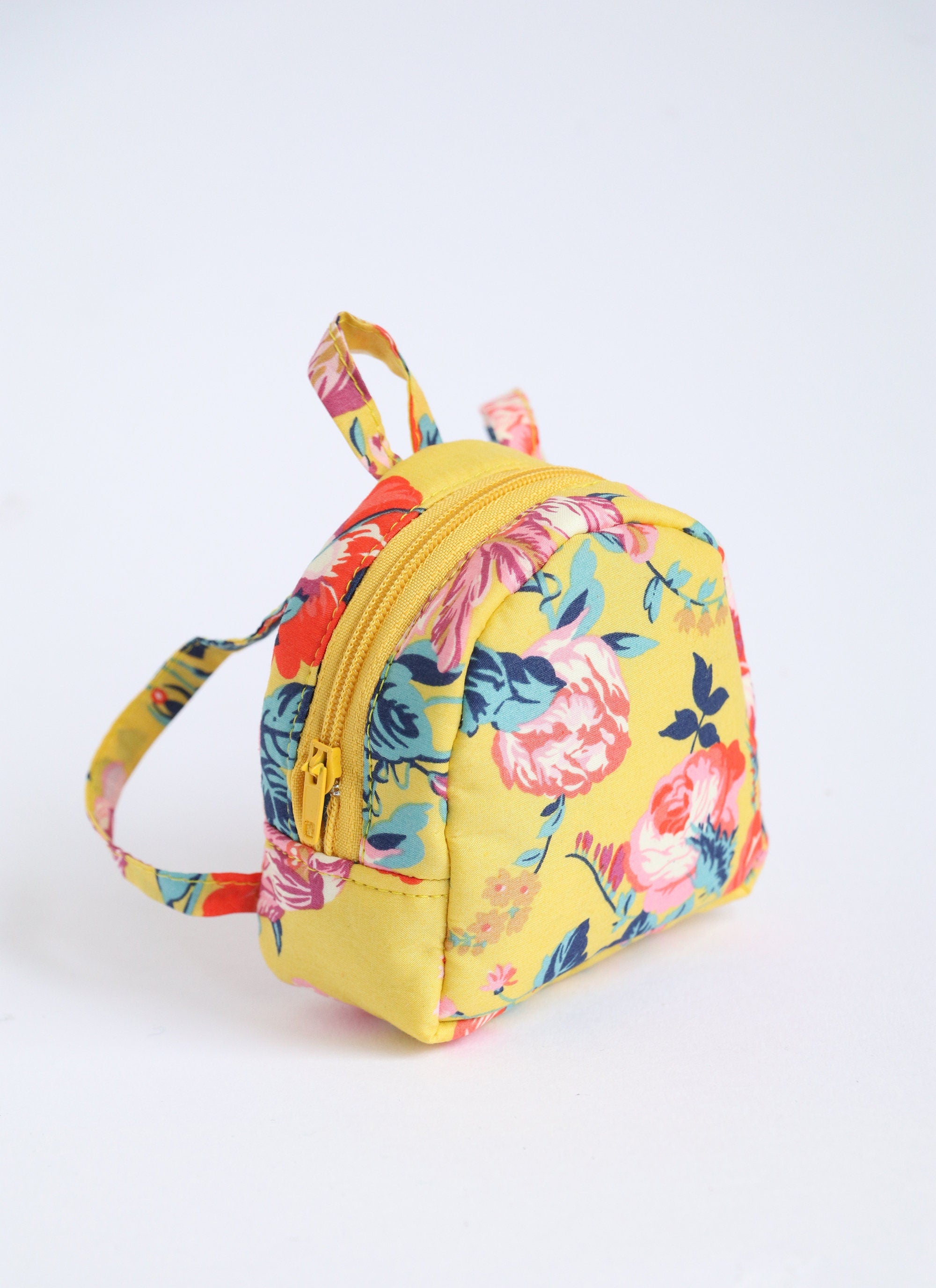 Miniature backpack in yellow