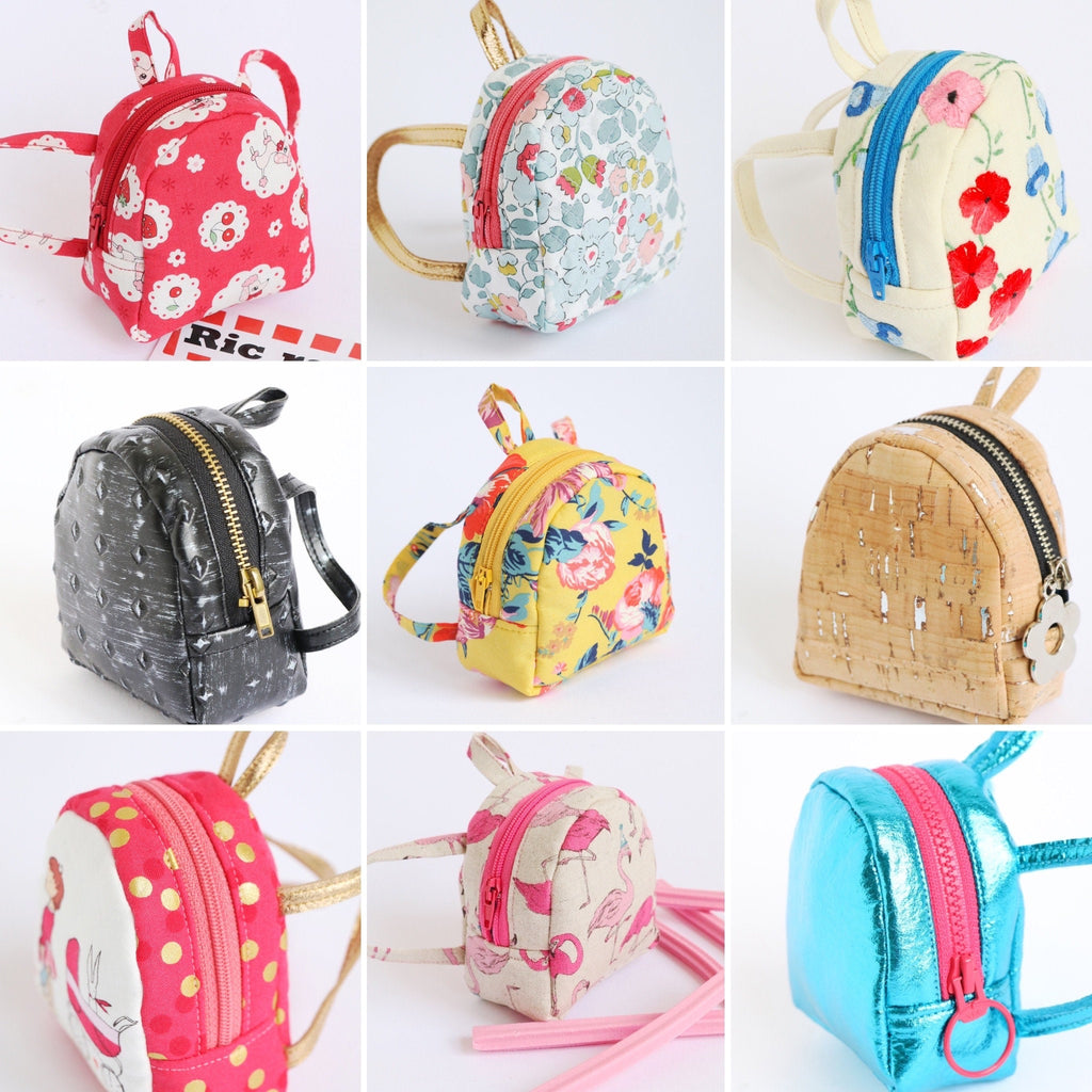 nine miniature backpacks in a variety of designs