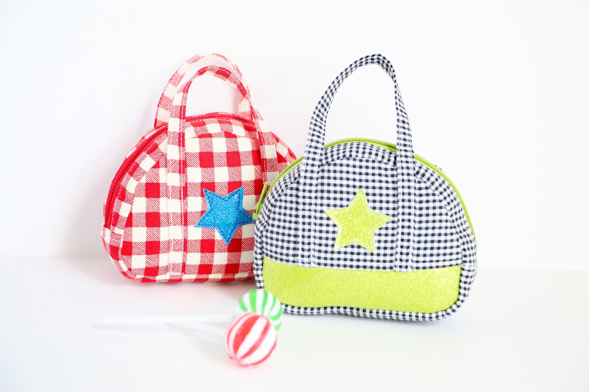 two mini bowling bags with stars on the side