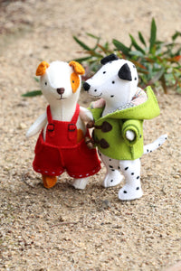 two small hand sewn felt dogs